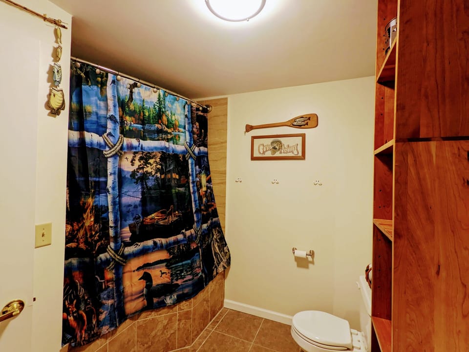 Downstairs with oversized jacuzzi tub and rain shower combo.