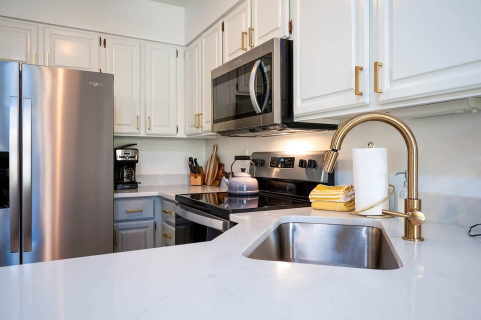Prepare meals with ease using the provided knife set, coffee maker, deep sink, and a selection of kitchen utensils, ensuring a seamless cooking experience during your stay.