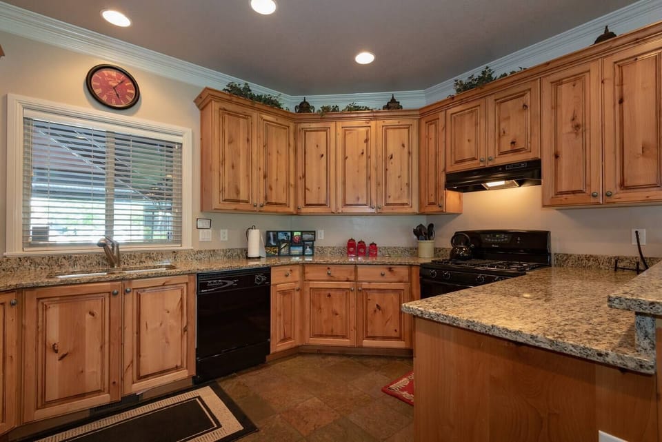 Prepare meals with ease using the provided knife set, coffee maker, double sink, and a selection of kitchen utensils, ensuring a seamless cooking experience during your stay.