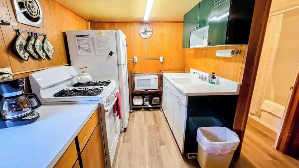 Kitchen is well equipped and features a classsic sink