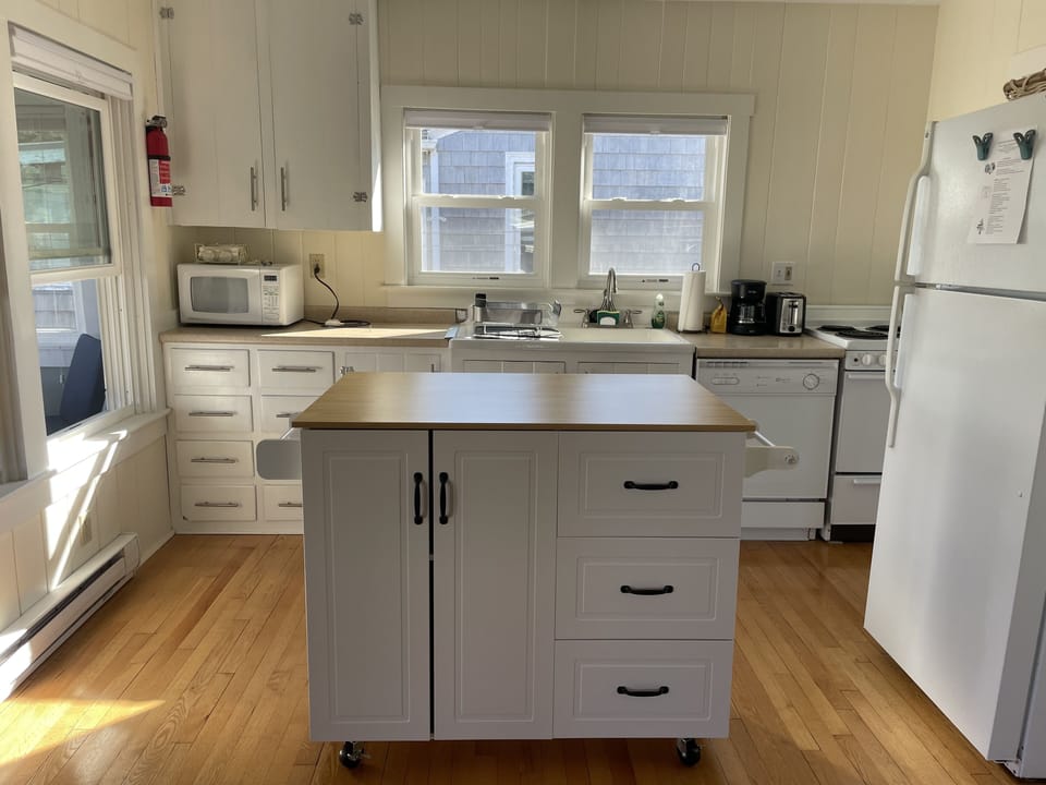 Kitchen Island on wheels for added storage and space.