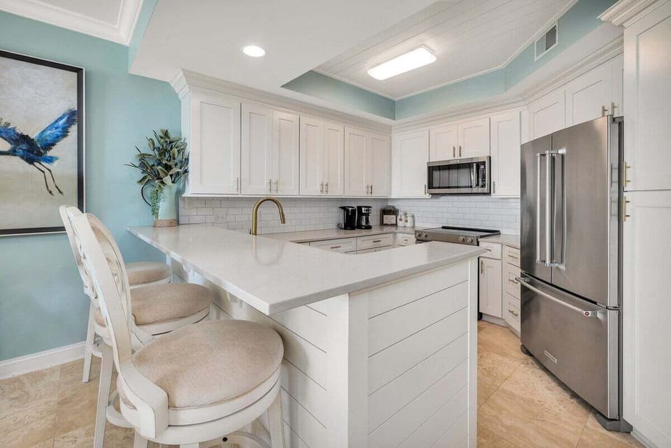 Saint Simons Grand #326 Kitchen with French Door Refrigerator, Electric Stove, and Over-the-Range Microwave