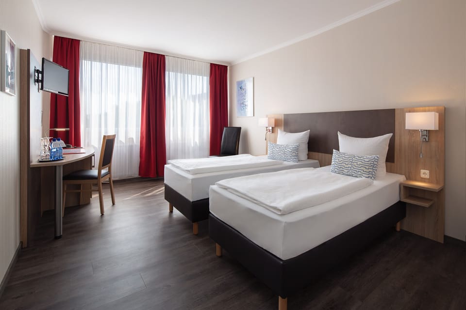 Double or Twin Room | Minibar, in-room safe, desk, soundproofing