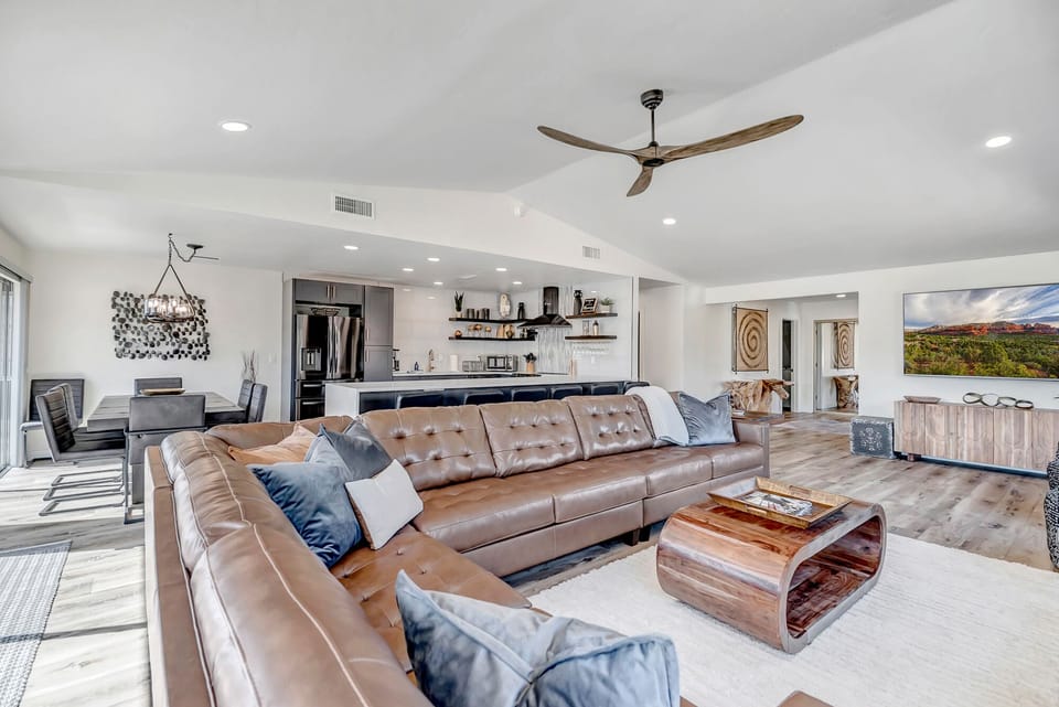 Living Room offers Large Leather Sectional and 85" Smart TV