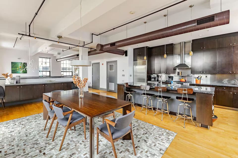 Dining area is open to the kitchen and has a large table to seat up to 10