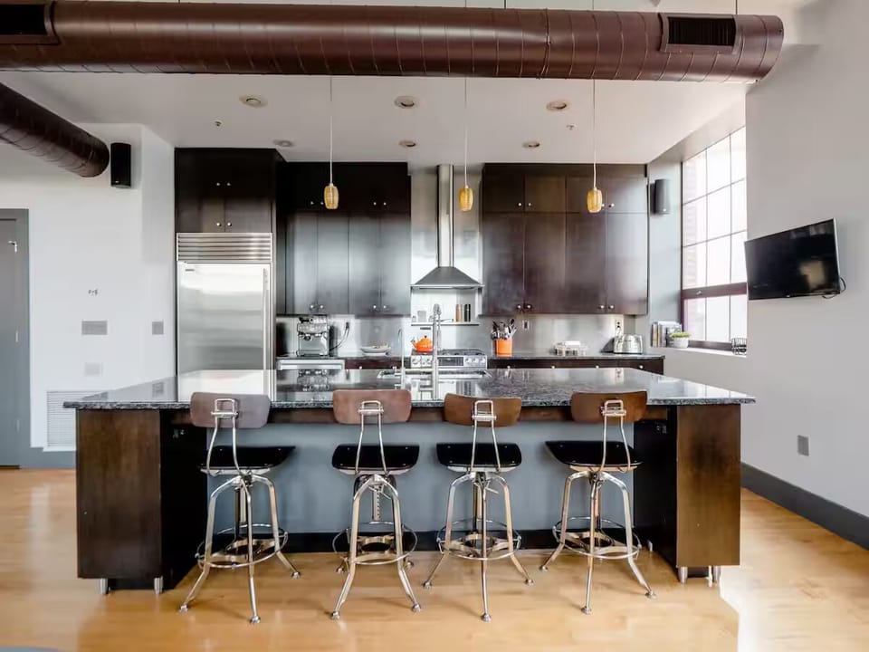 Modern chef's kitchen with extra large island and premium appliances