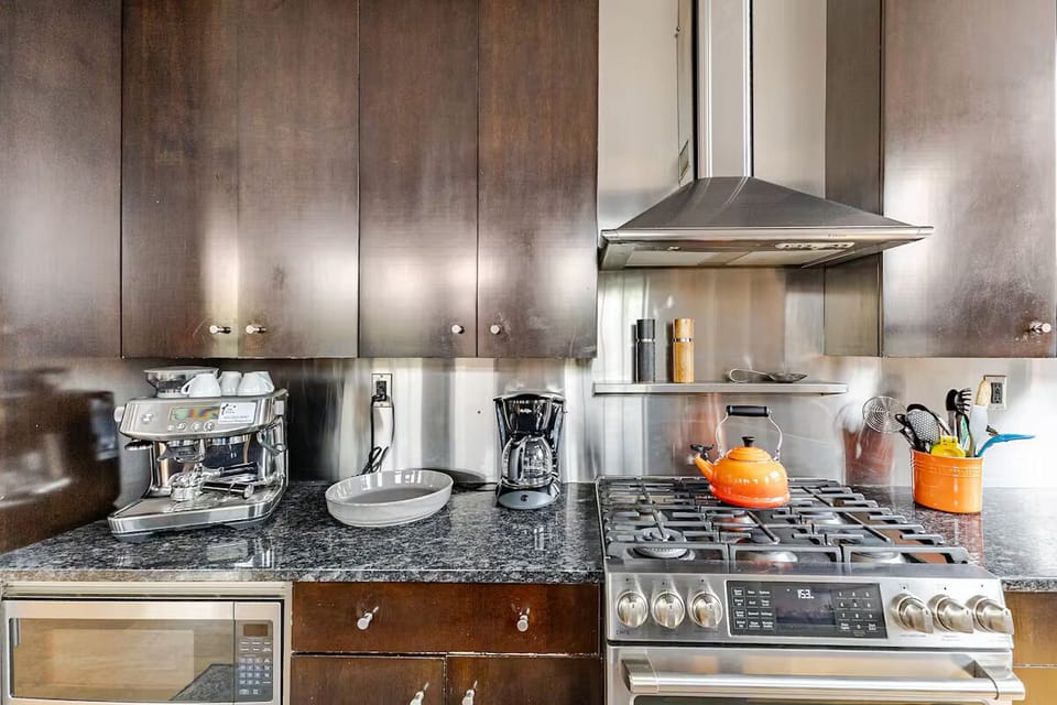 A Breville Espresso Machine, Krups 12-cup coffee machine and a Le Crueset kettle