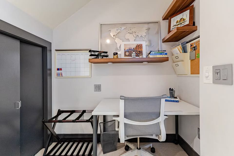 The third bedroom features a Queen bed and desk and chair for working