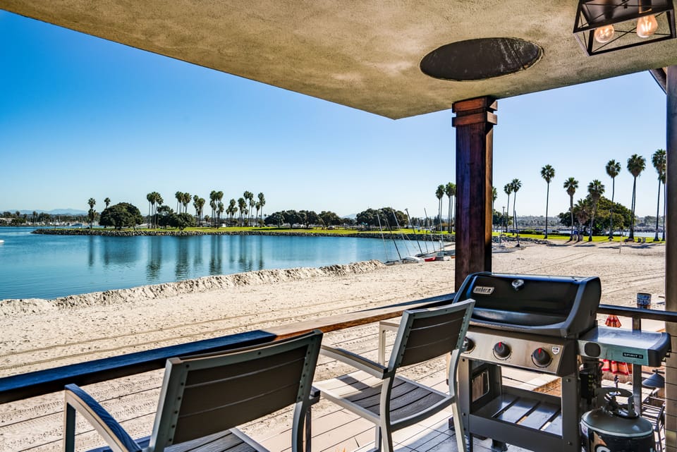 Enjoy stunning bay views while grilling on a high-end BBQ, perfect for outdoor dining and relaxation.