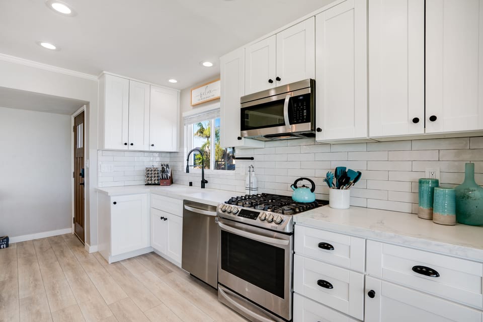 This modern kitchen features a cohesive, inviting layout with sleek cabinetry, clean countertops, and timeless design elements.