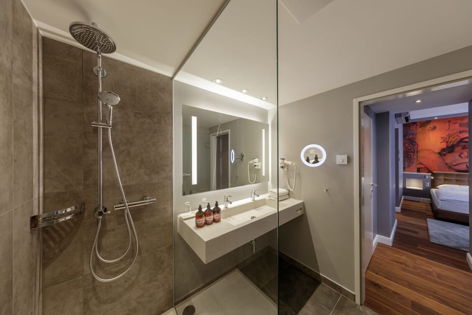 Family Suite, 2 Bedrooms (Deluxe) | Bathroom | Shower, eco-friendly toiletries, hair dryer, heated floors