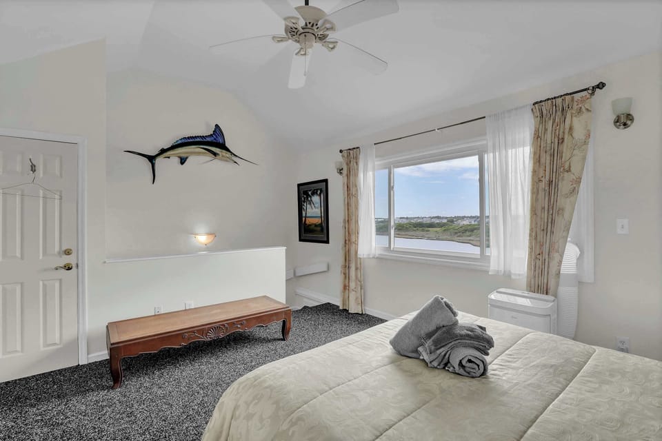Charming Bedroom with a Touch of Nautical Flair—Decorative Swordfish Included!