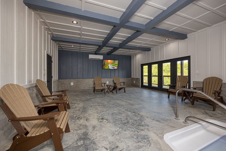 Private indoor pool with TV and seating