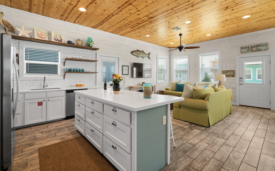 Kitchen & Living — Blue Island with Open Shelving & Coastal Decor