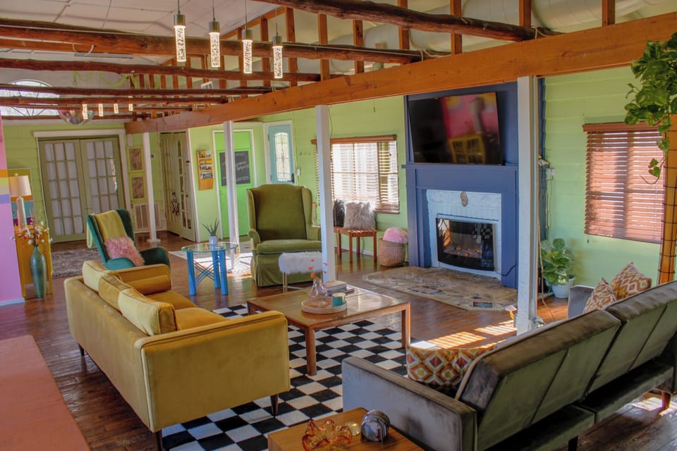 living room with pull out couch, skee ball, electric fire place, games, tv, VIEW