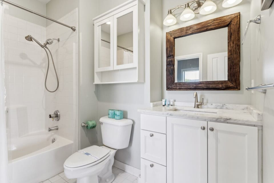 The master bedroom bathroom has a shower / tub combo for those who can`t decide which one they want on vacation!