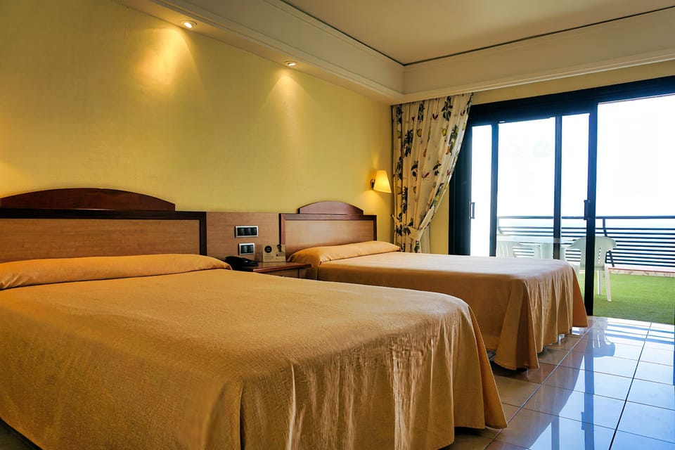 Minibar, desk, blackout drapes, bed sheets