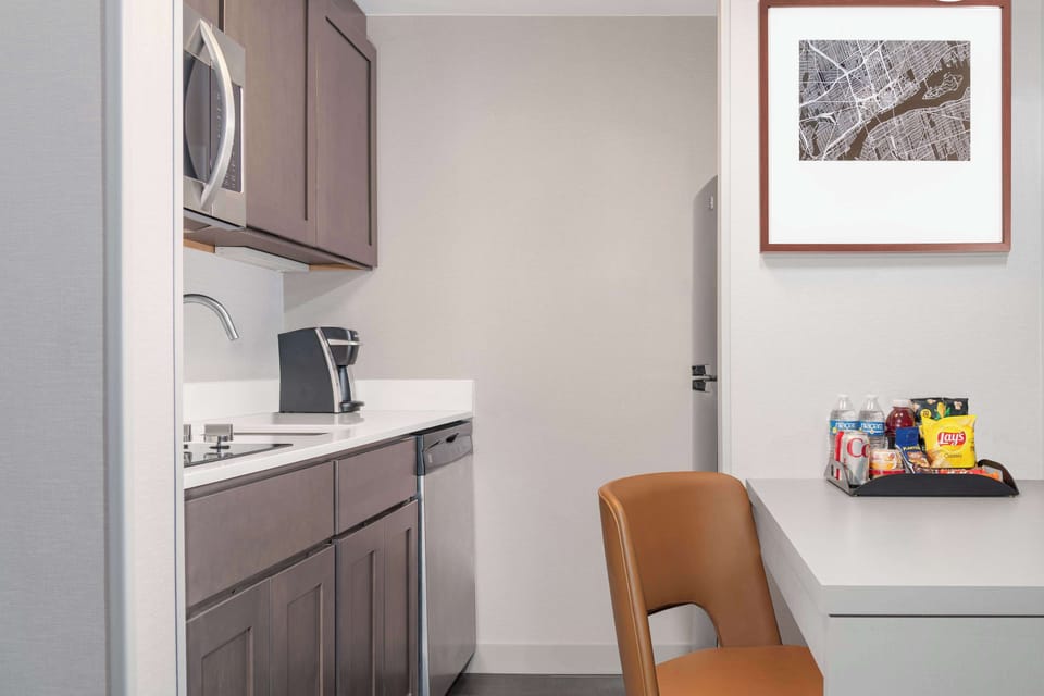 Full-size fridge, microwave, coffee/tea maker, cookware/dishes/utensils