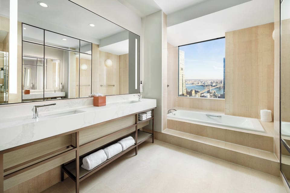 M Social Suite | Bathroom | Combined shower/tub, designer toiletries, hair dryer, towels
