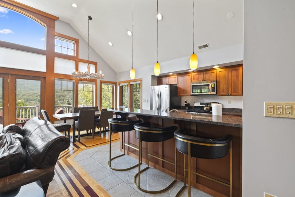 Enjoy cooking and dining with mountain views in this open-concept kitchen and living space.