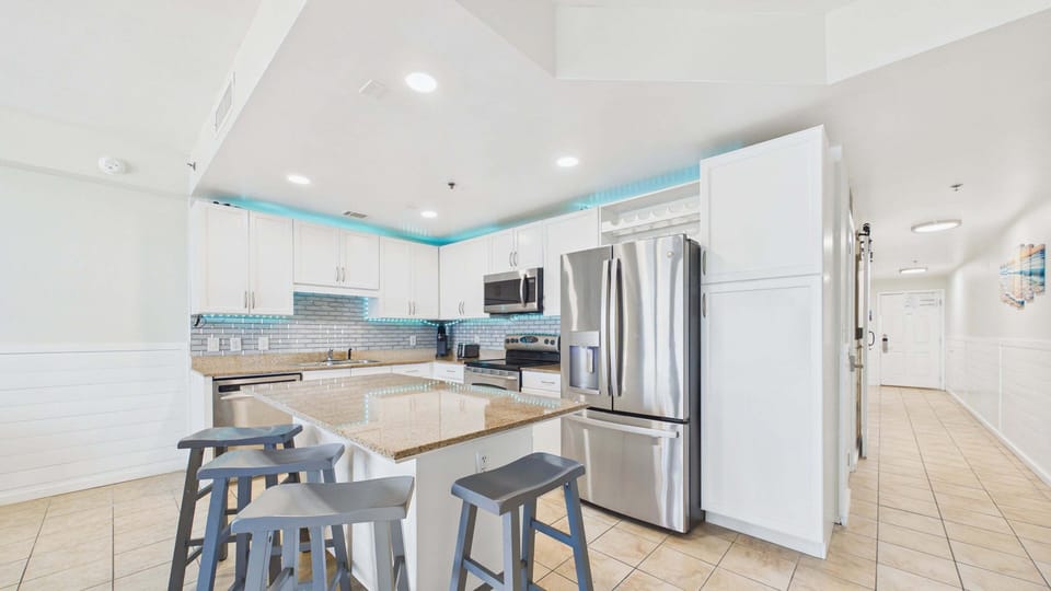 Full kitchen with kitchen island and all the necessary cooking essentials for your culinary needs