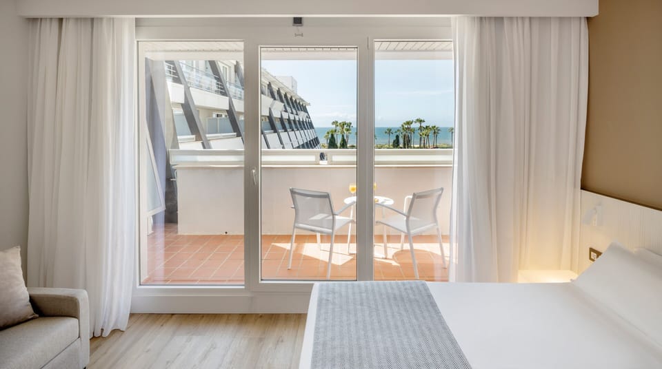Double Room, Sea View | Minibar, in-room safe, desk, laptop workspace