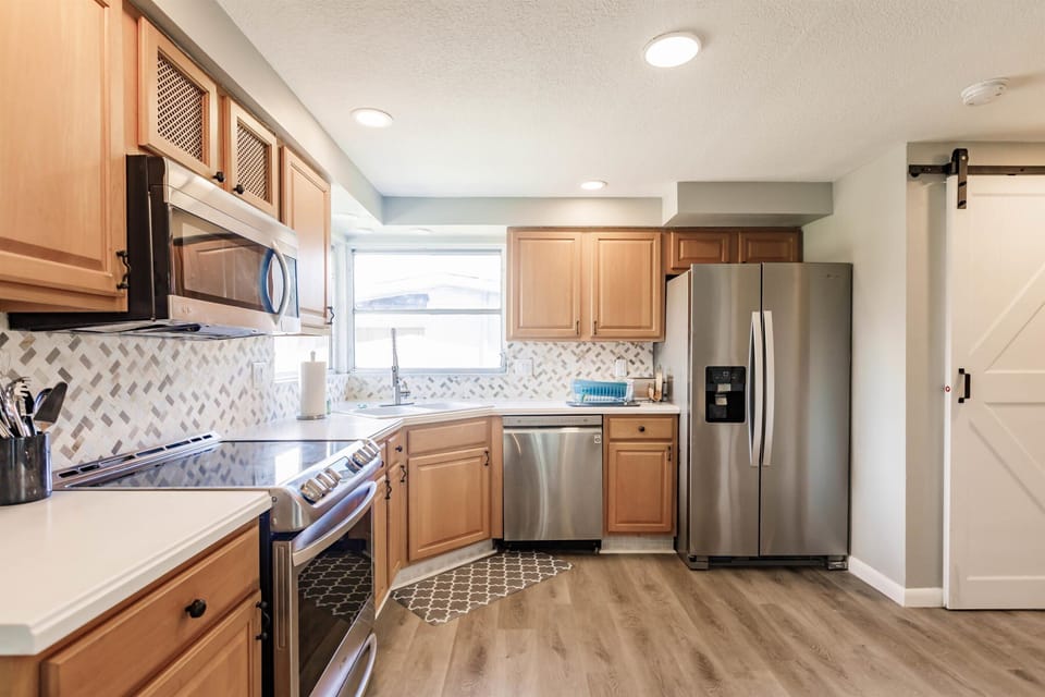 Kitchen with all stainless steel appliances.