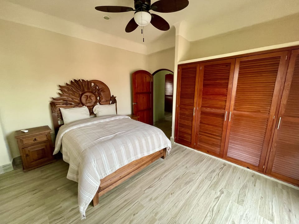 2nd bedroom with Queen bed, full bath, balcony access and closet