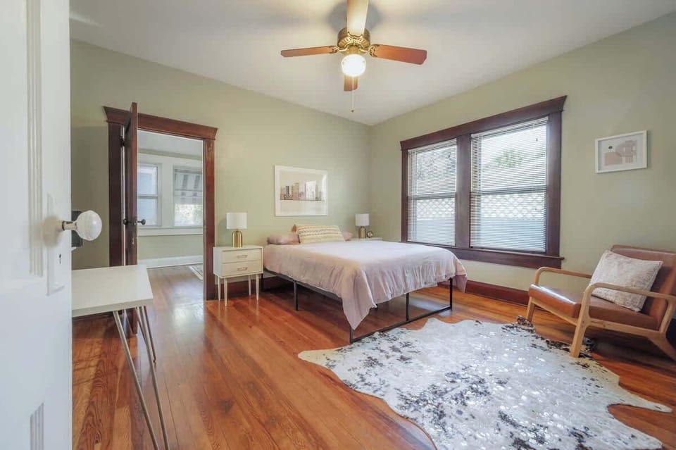 Enjoy a queen-size bedroom with a workspace designed for productivity and comfort
