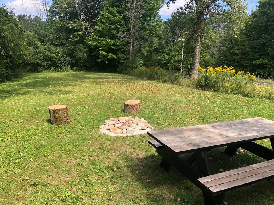 private bonfire and picnic area for the apartment.  camping available for fee