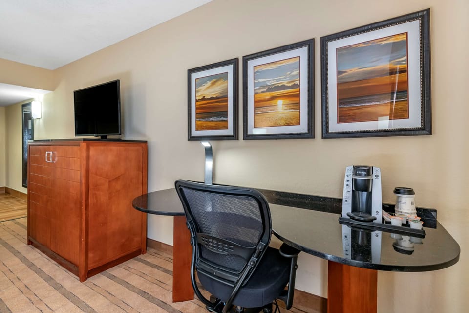 Premium bedding, desk, laptop workspace, blackout drapes