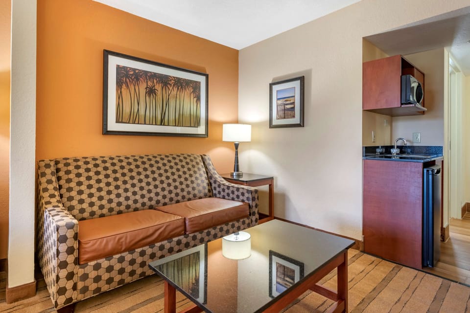 Premium bedding, desk, laptop workspace, blackout drapes