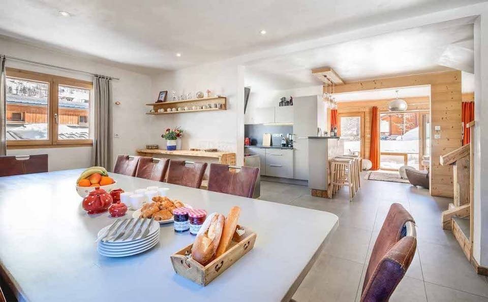 Chat with friends and family around the spacious dining table.