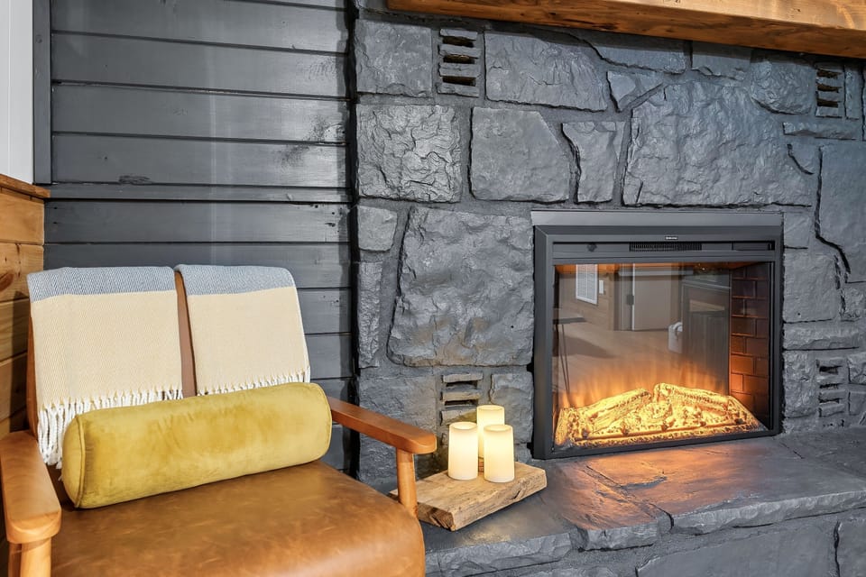 Electric fireplace with heater will set the mood and keep you cozy warm.