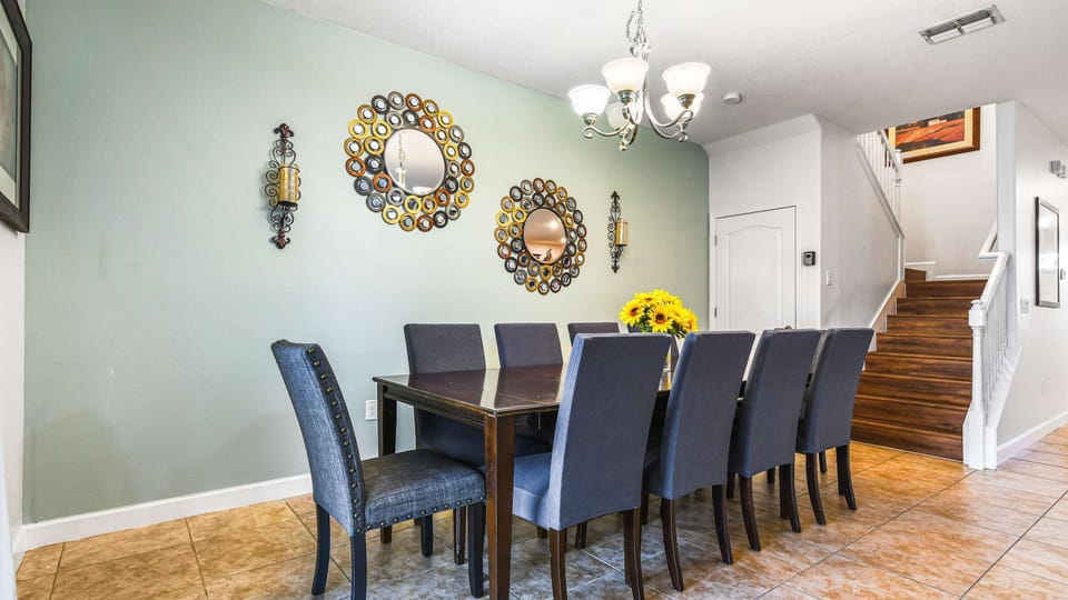 A stylish dining area with a dark wood table