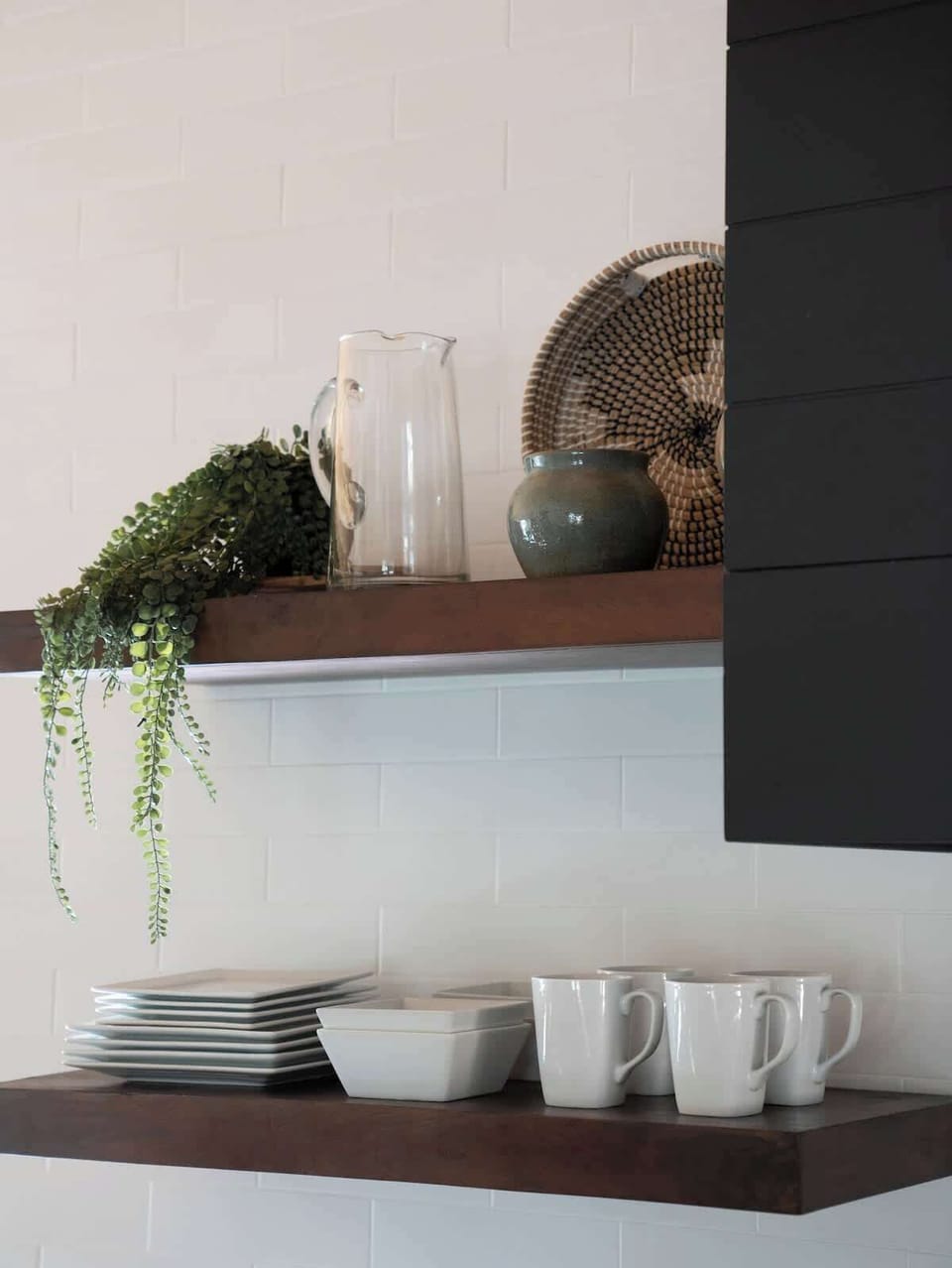 Full set of dishes with convenient access from open shelving. 