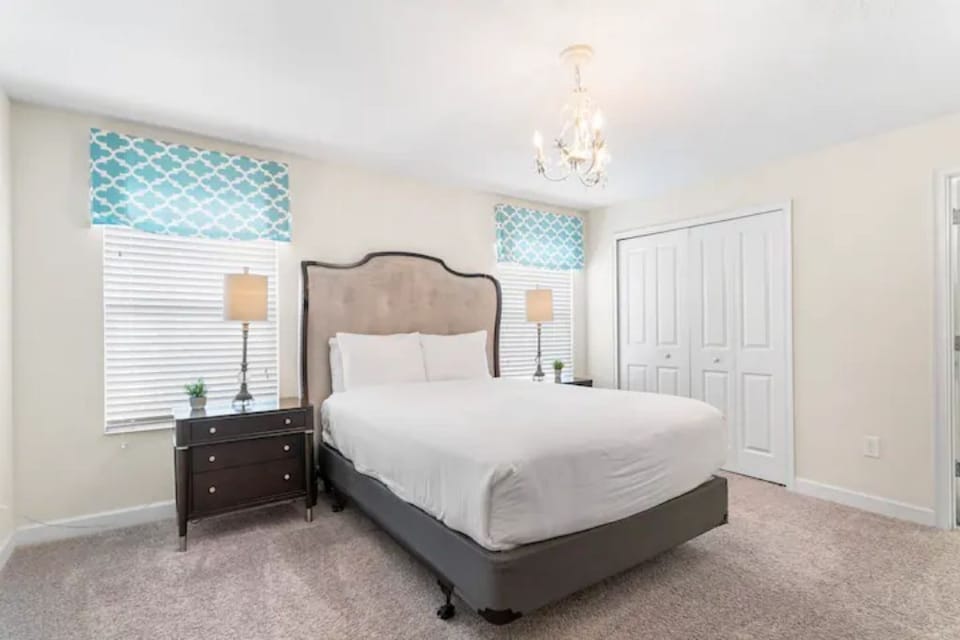 The queen-sized bed in this spacious bedroom is located on the second floor.