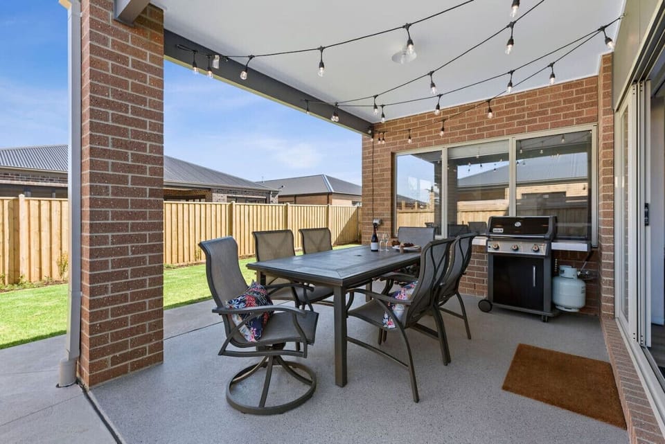 Complete outdoor dining and lawn backyard