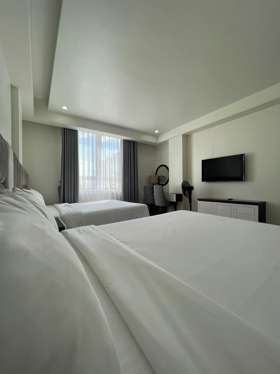 Deluxe Quadruple Room | Minibar, desk, laptop workspace, soundproofing