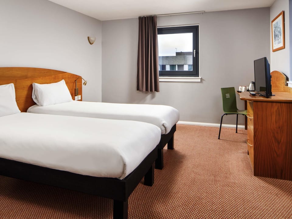 Twin Room, 2 Twin Beds | In-room safe, desk, iron/ironing board (on request), cribs (free)