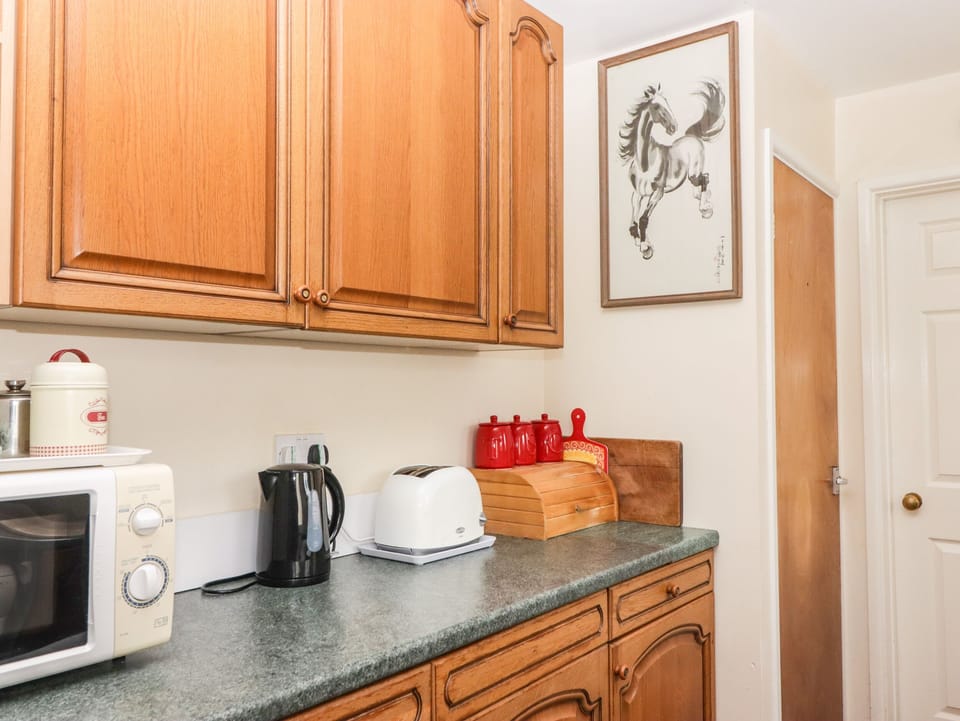 Fridge, electric kettle, cookware/dishes/utensils