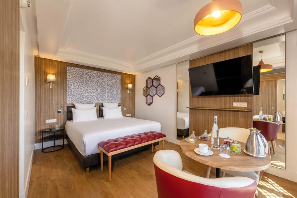 Deluxe Room | Premium bedding, in-room safe, laptop workspace, blackout drapes