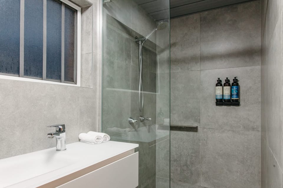 The ensuite serves as the main bathroom for this unit and contains a shower, vanity and toilet.