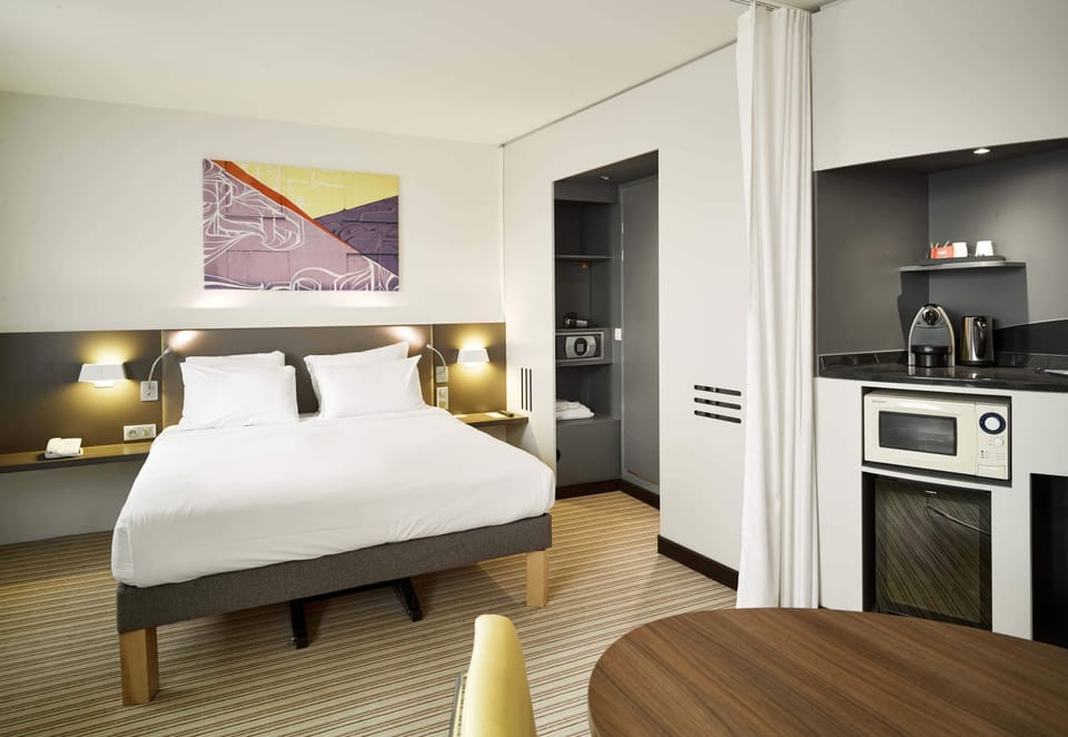 Comfort Double Room | Minibar, desk, laptop workspace, blackout drapes