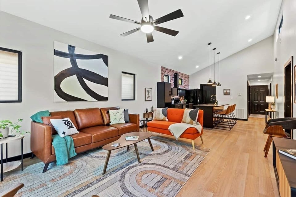 Living room w/ leather couch, loveseat & 3 side chairs. 