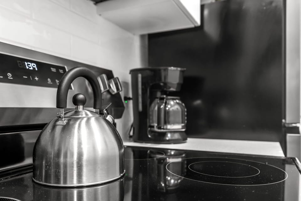 Premium 2-Bedroom 2-Bath Family Suite w/ Kitchen & Sofa Bed | Private kitchen | Fridge, microwave, stovetop, toaster
