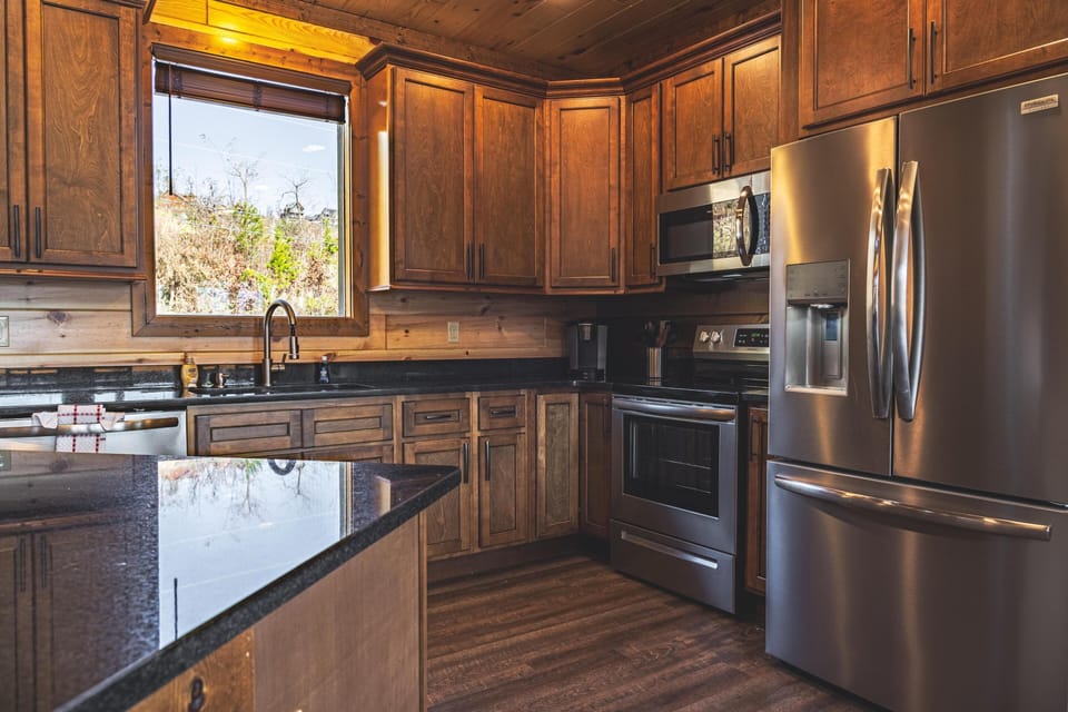 Fully equipped kitchen with stainless steel appliances. 