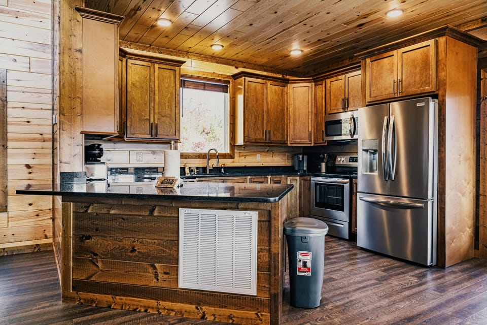 Fully equipped kitchen with stainless steel appliances. 