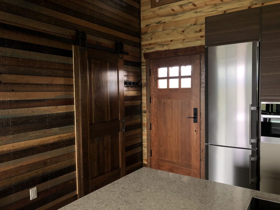 Front door . Note the barn door leading to the bathroom on the left