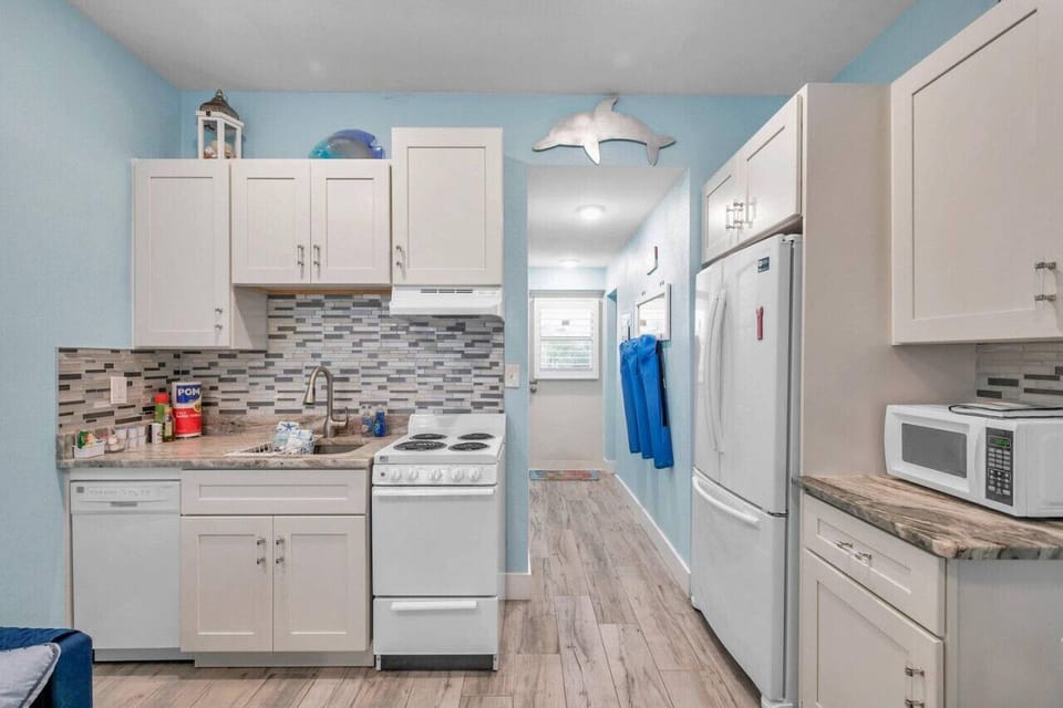 Compact kitchen & hallway setup designed for convenience during your stay.